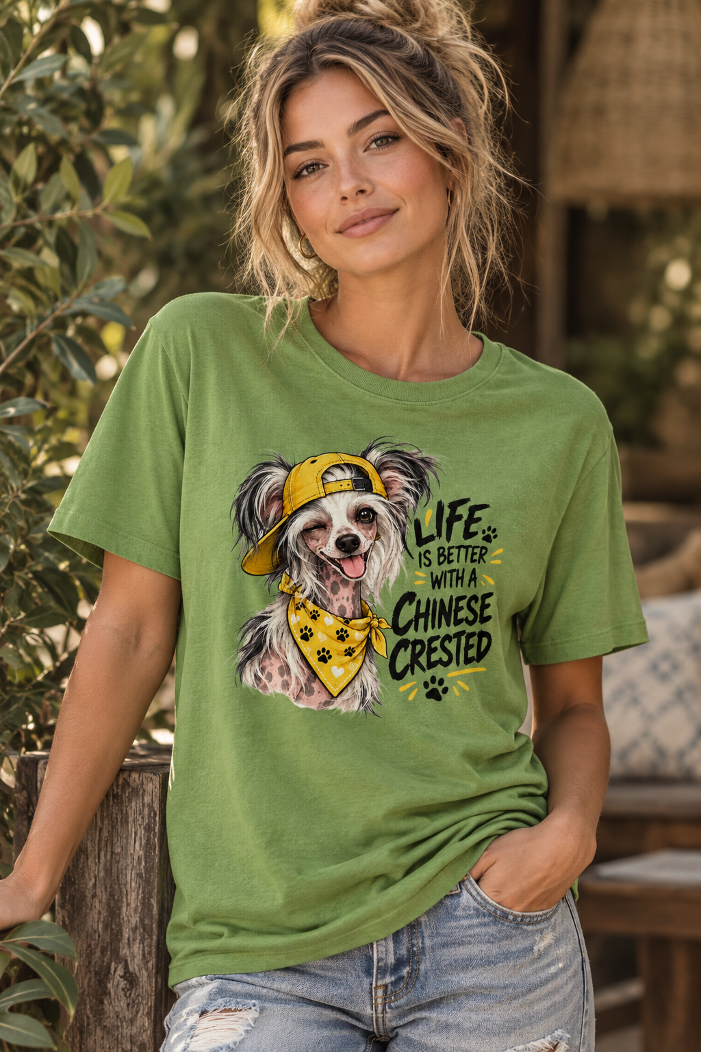Woman in green shirt with dog illustration and text, standing outdoors by foliage.